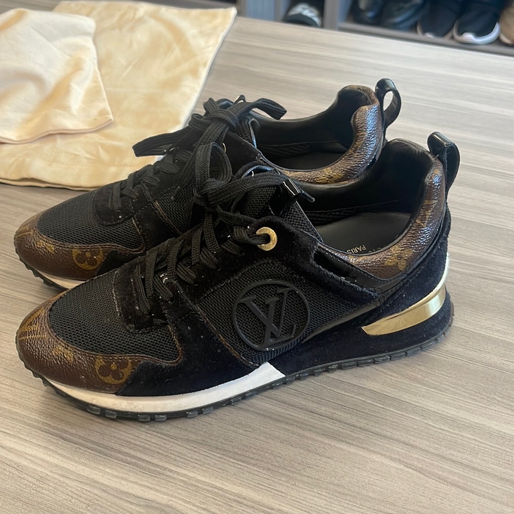 Louise Vuitton logo sneakers.